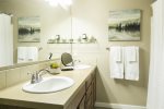 Indulge in the luxurious master bathroom featuring two sinks and a spacious shower with amazing water pressure. We provide plenty of towels and toiletries for your convenience, ensuring a comfortable and hassle-free stay.